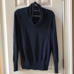 Turtleneck sweater with cowl neck.